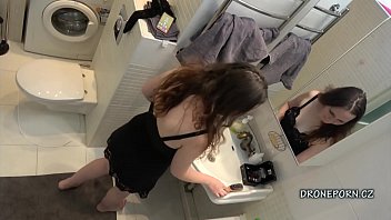 lesbians having sex in a bathroom
